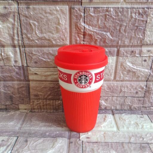 ماگ استارباکس خارجی بدنه سرامیک با روکش سیلیکون و درب سیلیکون نسوز